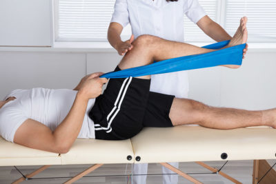 Physiotherapist Helping Patient While Exercising fisioterapia vicenza